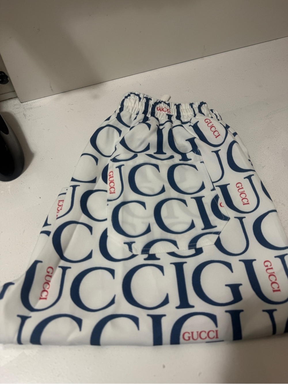 Beautiful shorts featuring a navy-and-red logo print with red accents. new - Picture 10 of 11